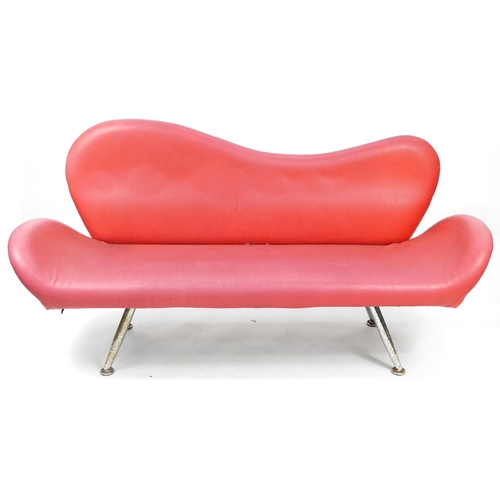 1048 - Red faux leather lips design salon settee raised on chrome legs, 180cm wide