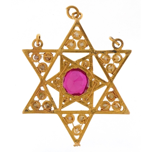 2020 - Indian unmarked high carat gold ruby and freshwater pearl six point star pendant, the ruby approxima... 