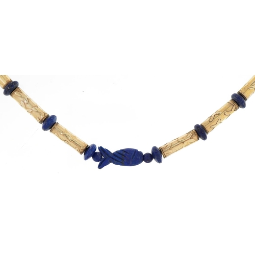 2073 - Egyptian style unmarked gold bead and carved lapis lazuli necklace, tests as 14ct gold, total 29.8g