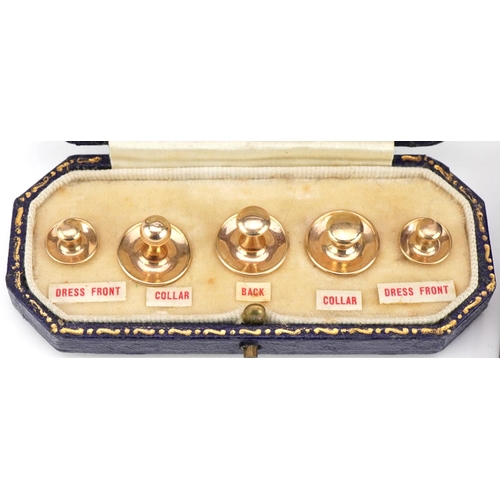 2099 - Two sets of 9ct gold dress studs, each housed in fitted leather boxes, the largest 1.2cm high, total... 