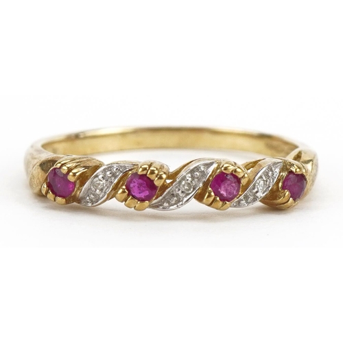 2229 - 9ct gold ruby and diamond crossover ring, size S, 2.1g