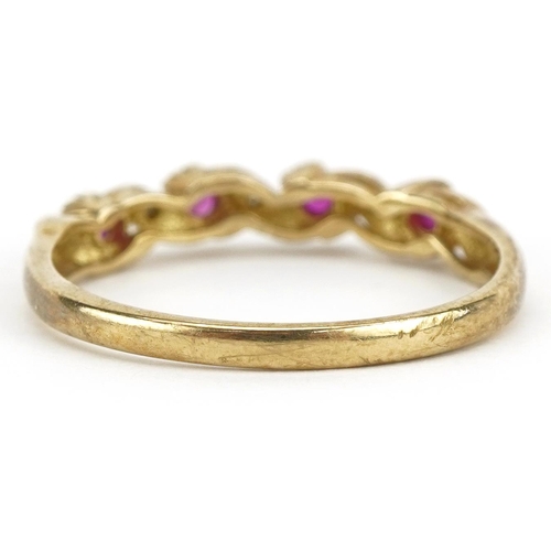 2229 - 9ct gold ruby and diamond crossover ring, size S, 2.1g