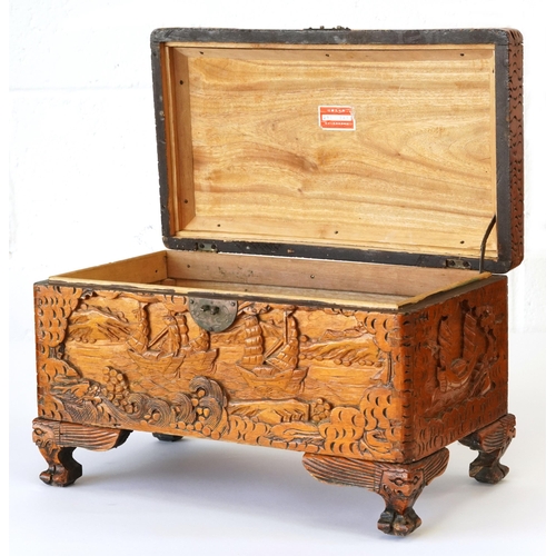 1034 - Chinese camphor wood table top chest carved with junks, 25cm H x 40cm W x 23cm D