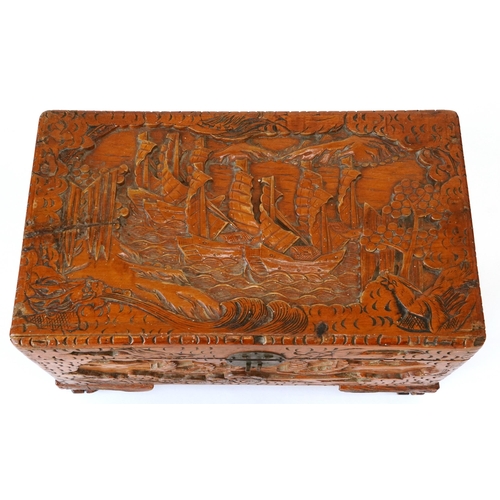 1034 - Chinese camphor wood table top chest carved with junks, 25cm H x 40cm W x 23cm D