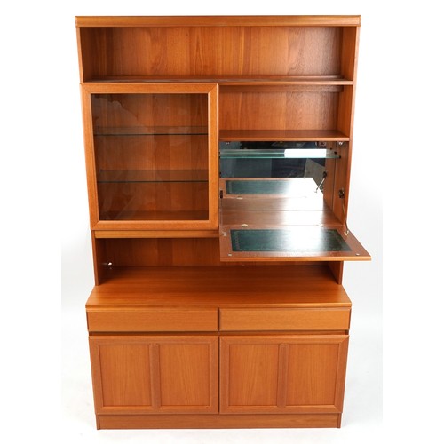 1063 - McIntosh, Mid century Scottish teak wall unit with glazed door and drinks cabinet above two drawers ... 