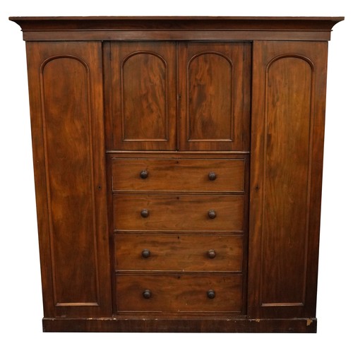 1005 - Victorian mahogany compactum wardrobe with two doors and two central cupboard doors above four drawe... 