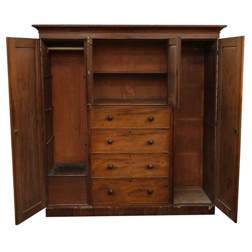 1005 - Victorian mahogany compactum wardrobe with two doors and two central cupboard doors above four drawe... 