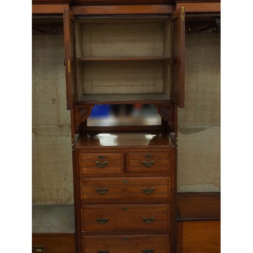 1038 - Edwardian satinwood compactum wardrobe with two bevelled glass mirrored doors, two central cupboard ... 