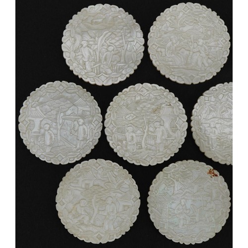 184 - Ten good Chinese Canton mother of pearl gaming counters finely carved with figures amongst pavilions... 