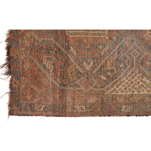 1022 - Antique Turkish rug having an all over blue and red geometric design, 180cm x 146cm