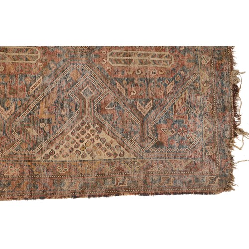 1022 - Antique Turkish rug having an all over blue and red geometric design, 180cm x 146cm