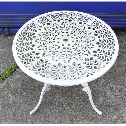 1142 - White painted aluminium garden table and four chairs, the table 67cm high x 87cm in diameter