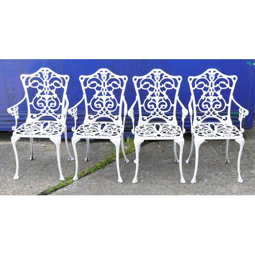 1142 - White painted aluminium garden table and four chairs, the table 67cm high x 87cm in diameter