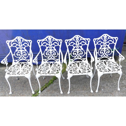 1142 - White painted aluminium garden table and four chairs, the table 67cm high x 87cm in diameter