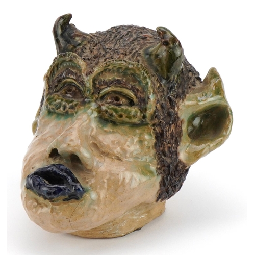 118 - Soren, 1980s mid century style pottery wall mask of a grotesque head, 18cm high