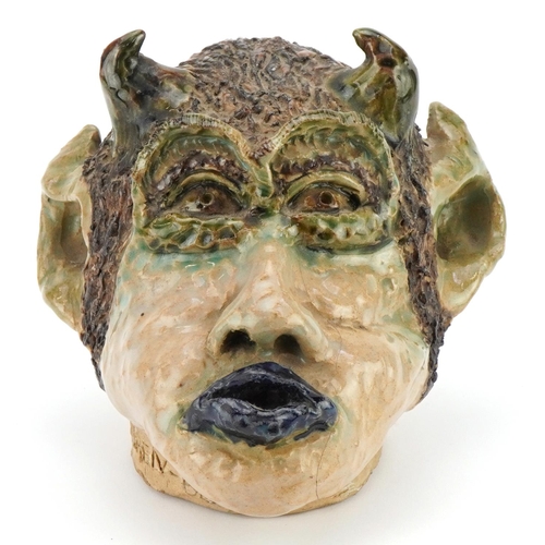 118 - Soren, 1980s mid century style pottery wall mask of a grotesque head, 18cm high