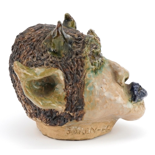 118 - Soren, 1980s mid century style pottery wall mask of a grotesque head, 18cm high