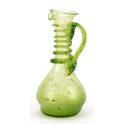 161 - Roman style green glass ewer with trailed decoration, 15cm high