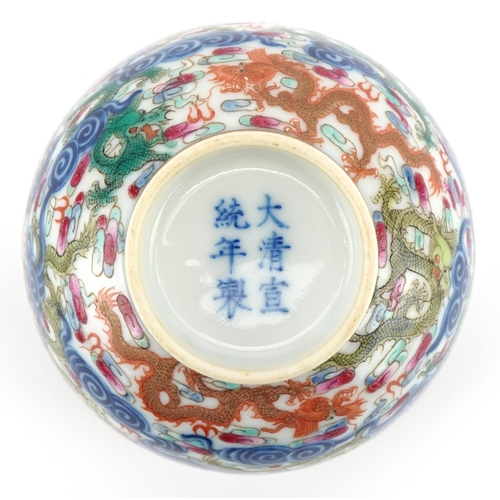 102 - Chinese doucai porcelain tea bowl hand painted with dragons amongst clouds, six figure character mar... 