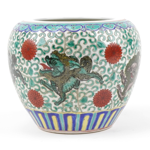 38 - Chinese porcelain jardiniere hand painted in the famille rose palette with mythical animals amongst ... 
