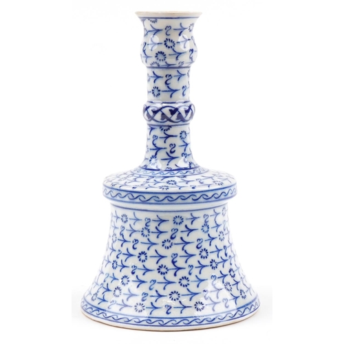 30 - Turkish Iznik pottery candlestick hand painted with stylised floral motifs, 26.5cm high