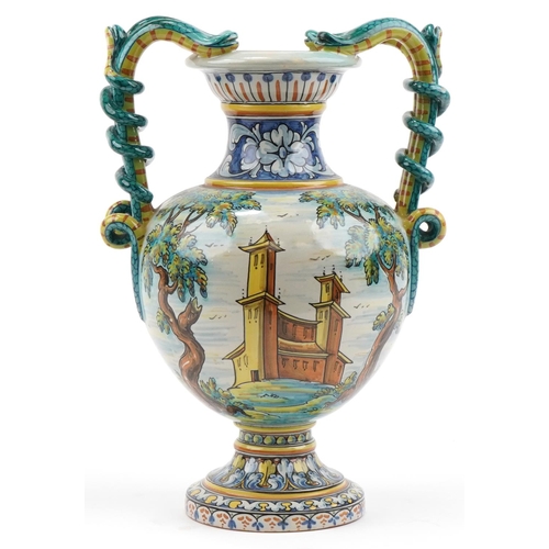 136 - Talevera, large Spanish Maiolica vase with twin serpent handles hand painted with a mythical bird in... 