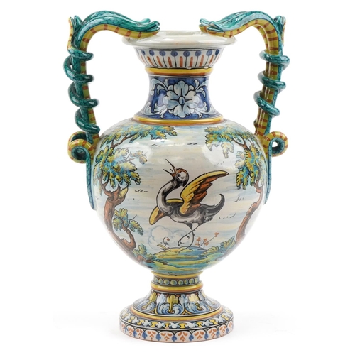 136 - Talevera, large Spanish Maiolica vase with twin serpent handles hand painted with a mythical bird in... 