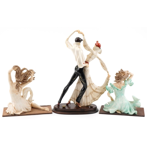 559 - After Amilcare Santini, three Art Deco style hand painted figures including a group of two tango dan... 