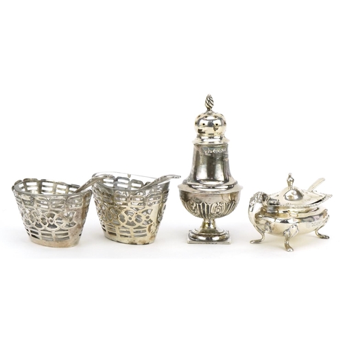 617 - Four silver cruets including a mustard with blue glass liner and spoon by Walker & Hall, baluster sh... 