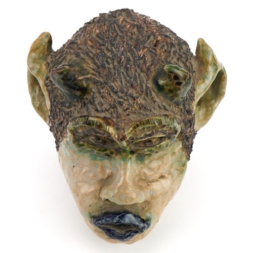 118 - Soren, 1980s mid century style pottery wall mask of a grotesque head, 18cm high