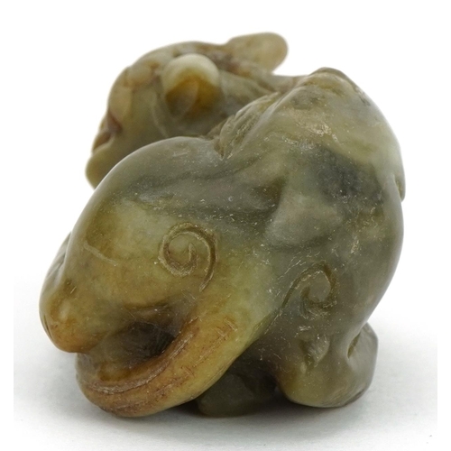 589 - Chinese green russet jade carving of a mythical cat, 5cm wide