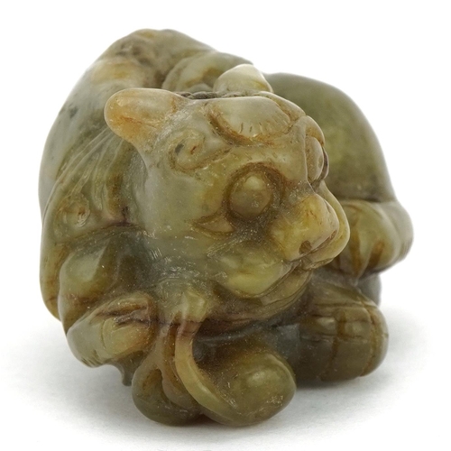 589 - Chinese green russet jade carving of a mythical cat, 5cm wide