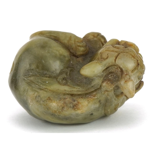 589 - Chinese green russet jade carving of a mythical cat, 5cm wide