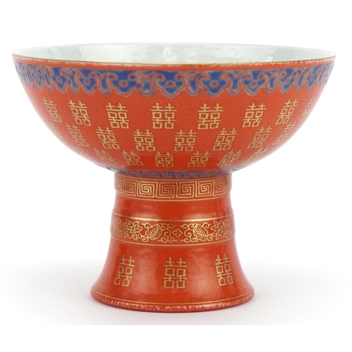 399 - Chinese porcelain iron red ground stem bowl with gilt and painted decoration, 14cm in diameter