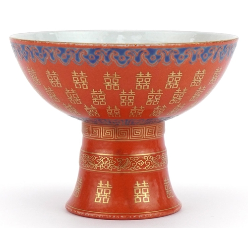 399 - Chinese porcelain iron red ground stem bowl with gilt and painted decoration, 14cm in diameter