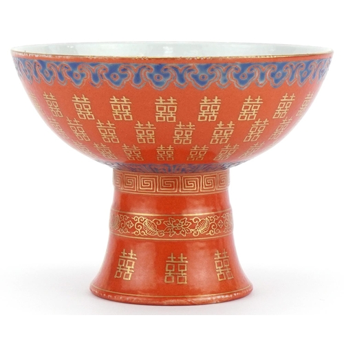 399 - Chinese porcelain iron red ground stem bowl with gilt and painted decoration, 14cm in diameter