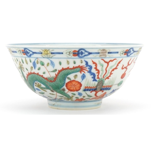 657 - Chinese doucai porcelain bowl hand painted with dragons and phoenixes chasing the flaming pearl amon... 