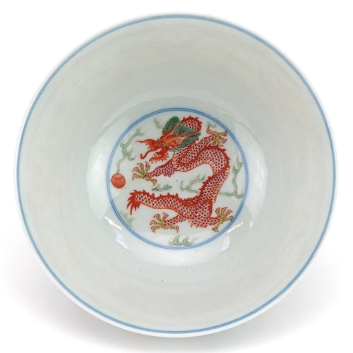 657 - Chinese doucai porcelain bowl hand painted with dragons and phoenixes chasing the flaming pearl amon... 