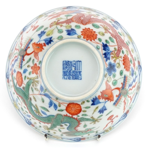 657 - Chinese doucai porcelain bowl hand painted with dragons and phoenixes chasing the flaming pearl amon... 