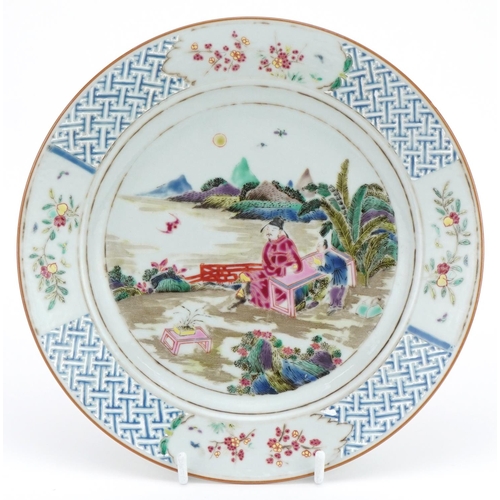 101 - Chinese porcelain plate hand painted in the famille rose palette with an emperor and attendant in a ... 