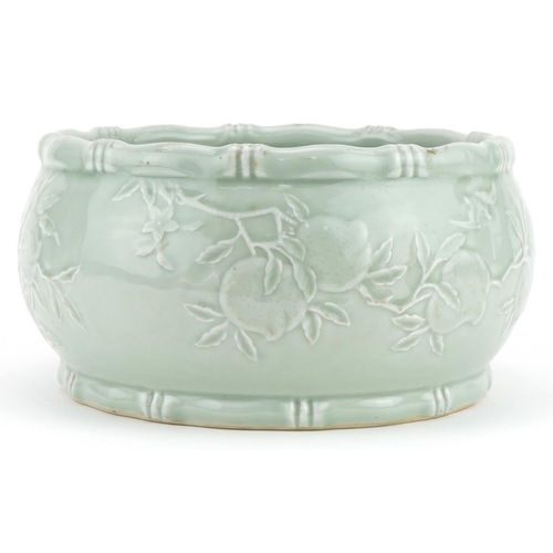 448 - Chinese porcelain celadon glazed bowl with faux bamboo borders decorated in low relief with peach tr... 