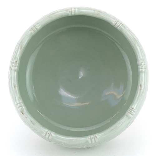 448 - Chinese porcelain celadon glazed bowl with faux bamboo borders decorated in low relief with peach tr... 