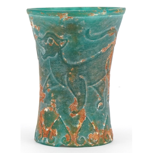 280 - Chinese archaic style turquoise glass beaker decorated with mythical animals, 10.5cm high