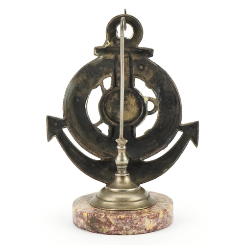 232 - Shipping interest cast metal lifebuoy and anchor pocket watch stand with circular marble base, 18cm ... 