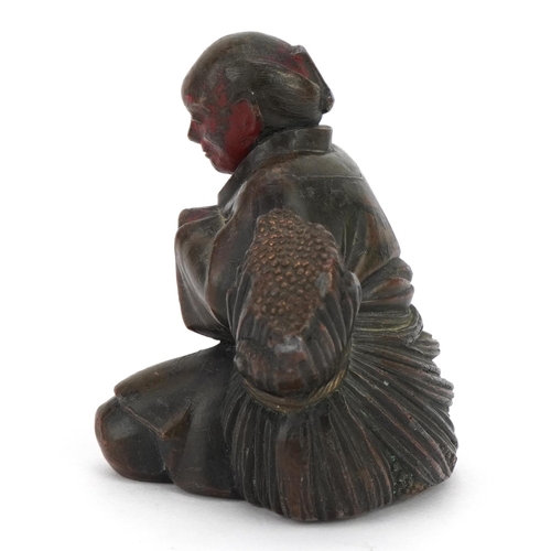 768 - Japanese antimony partially lacquered okimono of an figure with wheat, 7cm high