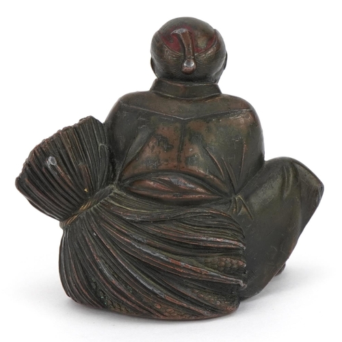 768 - Japanese antimony partially lacquered okimono of an figure with wheat, 7cm high