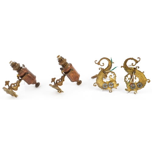 336 - Two pairs of 19th century style brass seahorse design wall sconces including a pair with copper gimb... 