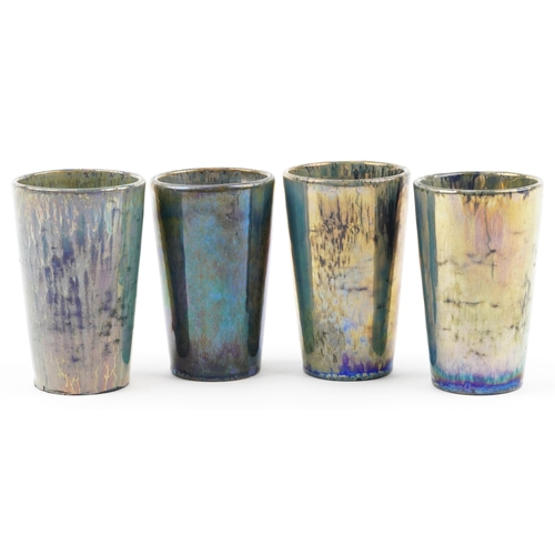 362 - Alphonse Cytere-Rambervillers, set of four French pottery beakers having iridescent green and blue g... 