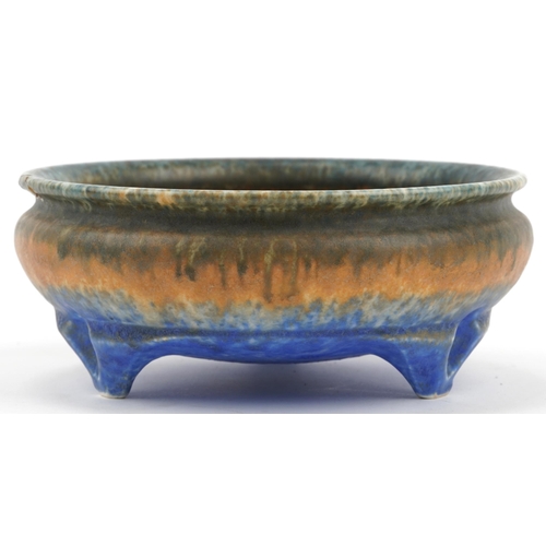 430 - Ruskin, Arts & Crafts three footed bowl having a mottled green, orange and blue glaze, impressed mar... 