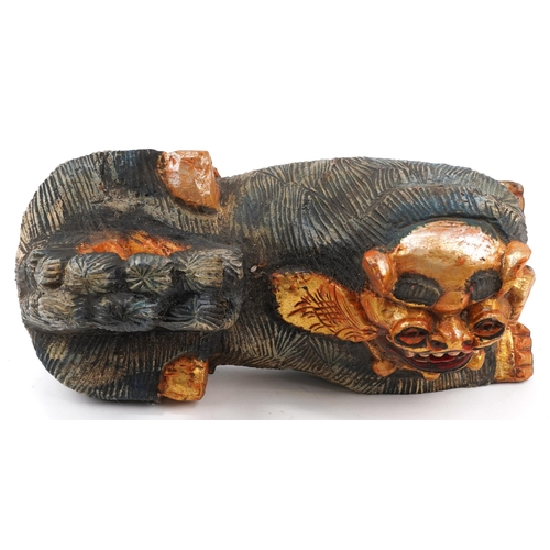 775 - Chinese painted carved wood recumbent lion, 48cm in length